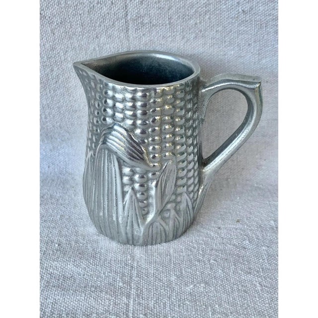 Interesting vintage pewter creamer. Made by The Wilton Armetale Co and in the shape of corn. Majolica style. Could also be...