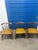 The selected item is a vintage Colonial-style Windsor captain's chair, featuring a low, curved spindle back and an...