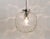 A beautiful Space Age pendant light with a large clear glass globe and chrome-plated hardware. The globe is hand blown and...