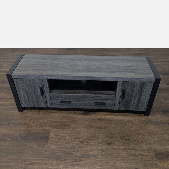 This TV stand has a unique urban industrial design, highlighted by powder-coated steel rectangle sides that form the...