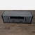 This TV stand has a unique urban industrial design, highlighted by powder-coated steel rectangle sides that form the...