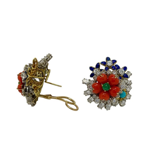 These gorgeous and unique flower cluster earrings contain heart shaped coral petals with a cabochon treated emerald center...