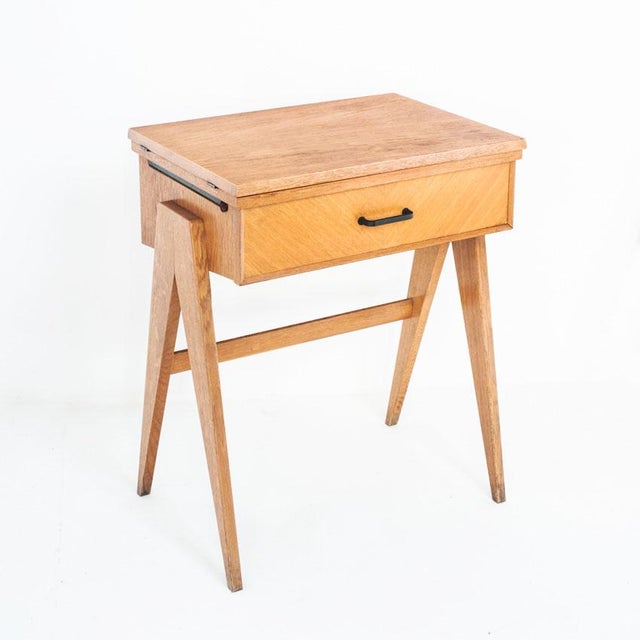 Originally, this piece of furniture housed a sewing machine.