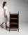 Open oak bookshelf in Weathered Dark Oak. The weathered dark oak surface highlights three open shelves, simple square...