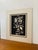 Vintage black and white portrait print depicting a highly expressive human face rendered in strong contrast. The...