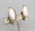 1950s ellipse with point at the bottom goldtone Florentine finish with white resin marquise rhinestone clip earrings....