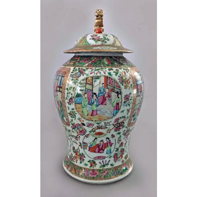 Large Chinese porcelain baluster-shaped vase with lid, decorated with two horizontal panels front and back enclosing...