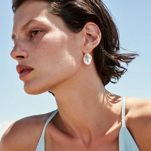 One large baroque pearl on a 14K gold hook. Irregular by nature — no two the same shape, no two catching light the same...