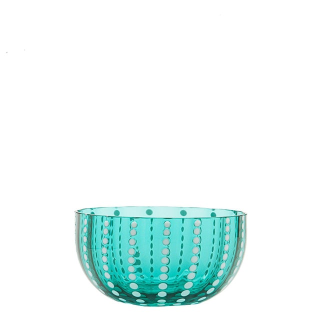 Collection for the table in clear colored glass. It includes tumblers for water and soft drinks, wine glasses, flute...