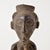 Hand-carved wood Kusu figure with distinct body markings and influence from their Songye and Hemba neighbors. This unique,...