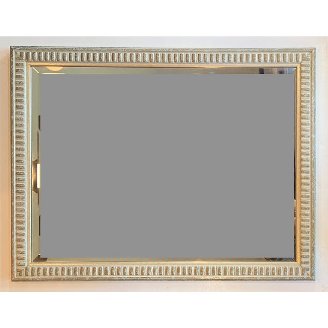Modern yet traditional solid wood mirror with a repeating dentil architectural pattern. The frame's finish is a unique...