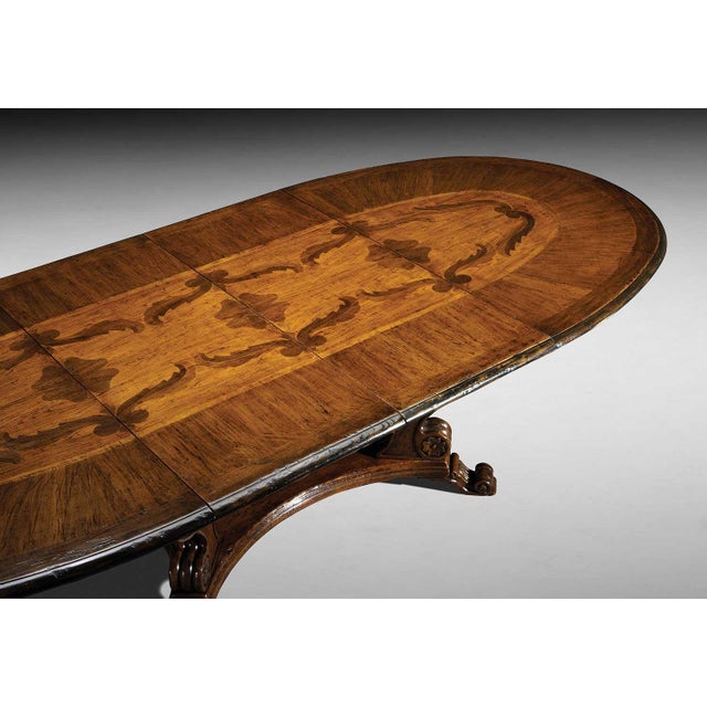 Handcrafted in Italy from solid walnut, this oval extension dining table features a richly figured walnut top with...