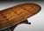 Handcrafted in Italy from solid walnut, this oval extension dining table features a richly figured walnut top with...