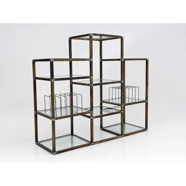 Vintage brass modular shelving unit dating back to 1970 with chromed steel joints. It features 10 shelves, two of which...