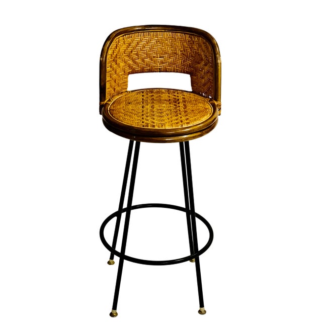 Vintage mid 20th century bamboo and rattan swivel bar stool with iron base. Comfortable and sturdy single stool which...