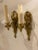A pair of circa 1920’s French empire style one light sconces with Sean’s head