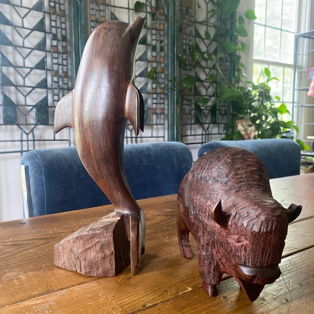 Great wooden statues carved in the image of a dolphin and a Buffalo. Beautiful accents to any decor! Please check out my...