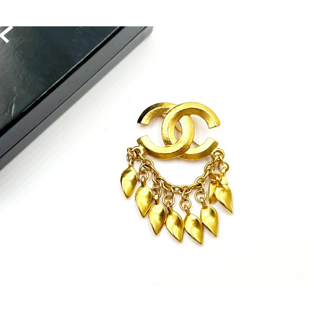 Chanel Rare Vintage Gold Plated CC Dangling Leaves Brooch *Marked 95 *Made in France *Comes with the original box -It's...