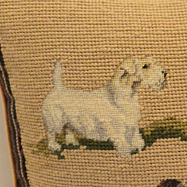 A striking and beautifully crafted vintage hand-stitched wool needlepoint throw pillow featuring a charming quartet of...