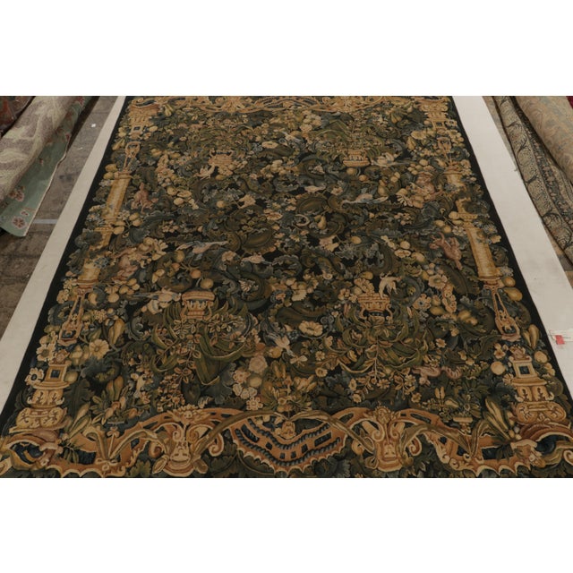 Hand-knotted in wool, a 10x12 marvel from our European collection inspired by classic Tudor rugs renowned for grand...