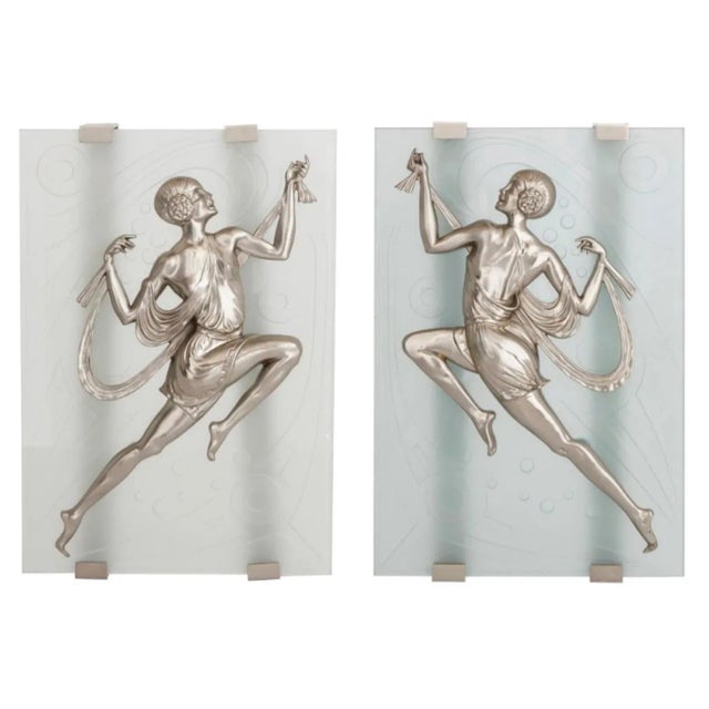 Impressive in scale, a pair of French Art Deco dancing ladies wall sconces. Depicted are front and back views of prancing...
