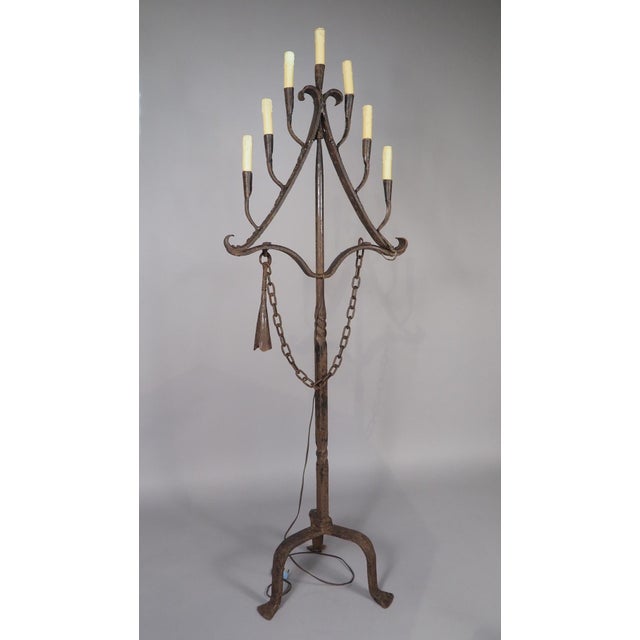 More information coming soon… The seven lights on this French wrought iron floor candelabra are arranged in a triangular...
