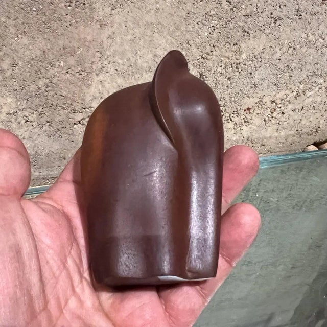 For your consideration, a 1970s modernist mini elephant sculpture made of carved wood. It features an abstract, minimalist...