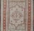Measures: 3'4 x 5'4 Hand-knotted in Turkey during the 1940's, this vintage Oushak features a great medallion and layer...