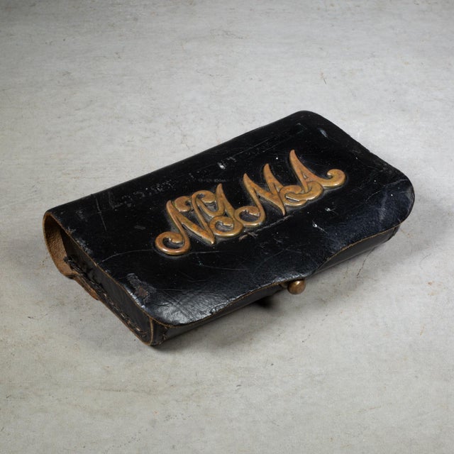 ABOUT This Indian Wars-era pouch is constructed of heavy black leather and features its original, Victorian, interlocking...
