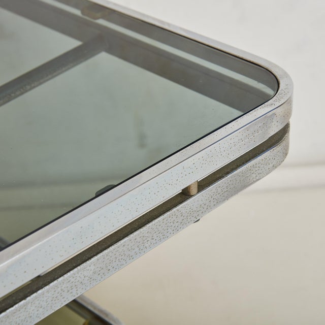 A striking Italian three-tier bar cart designed by Allegri Arredamenti in the 1970s. The Space Age style, chrome frame...