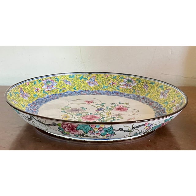 Antique Chinese Qianlong Period (1736 - 1795) Canton enamel dish. Painted enamel on copper in famille jaune palette....