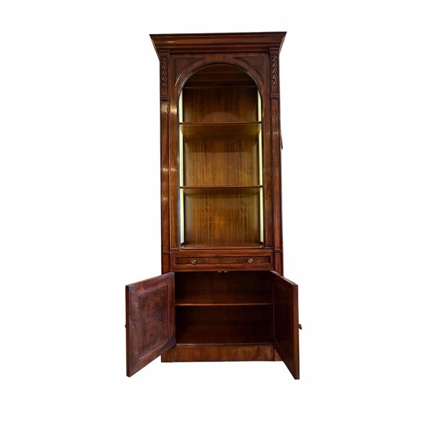 A sophisticated blend of modern functionality and timeless craftsmanship, this John Widdicomb display case showcases the...