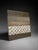 Modern textured abstract wall art featuring neutral brown, beige, taupe, cream, and earthy gray tones. The raised circular...