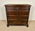 Elegant Spanish chest of drawers crafted in solid oak with strong architectural lines and a richly aged patina. The piece...