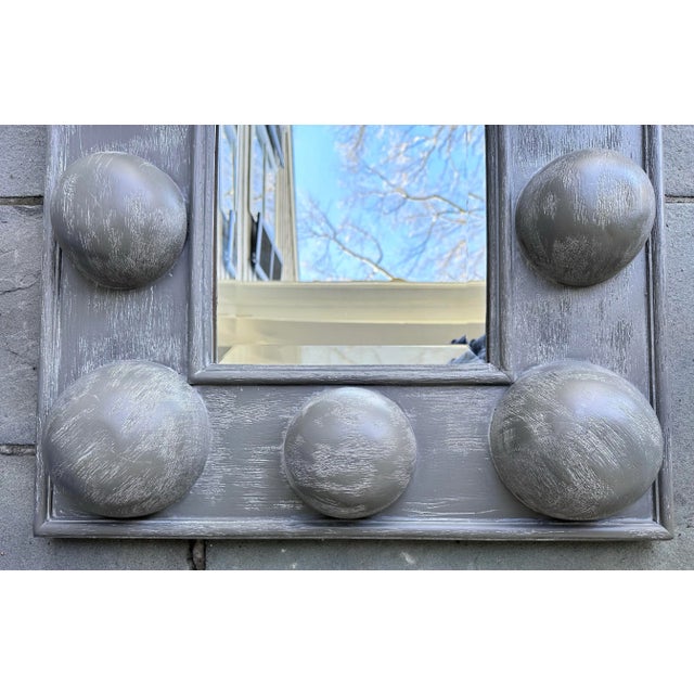 Square shape Boulder mirror with gray wash finish attributed to CFC of Los Angeles from repurposed wood. It measures 24”...