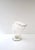 A clear transparent blown-glass art glass vase with a controlled bubble design. Vase is oblong fan shaped with circular...