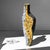 Fragment ochre ii is a sculptural art object whose bold architectural form evokes fractured geology rather than...