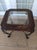 Glass Top End Table With Leaf Etched Trim On Dark Metal Legs Only One Table Style: Traditional Color: Black Dimensions:...