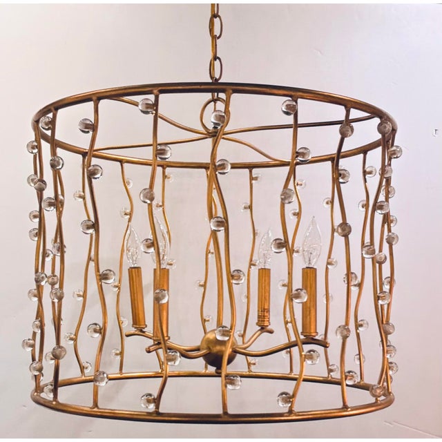 Original retail $2690, stylish Currey & Company Modern Gold Adagio Chandelier, crystal accents, showroom floor sample