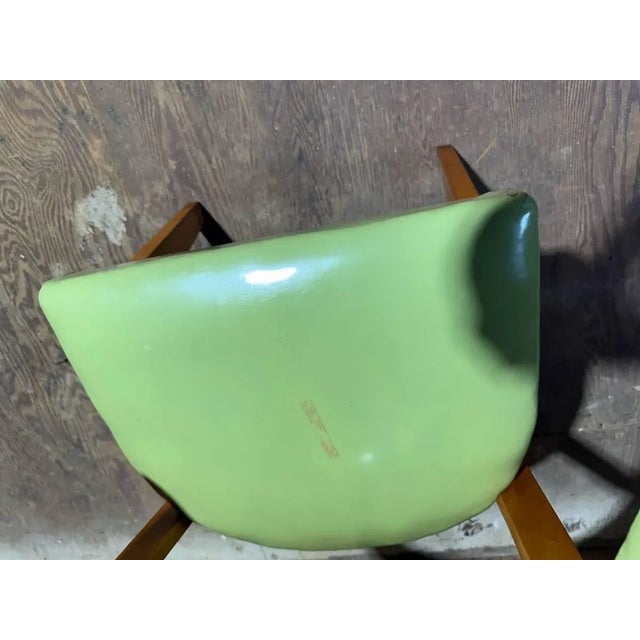 Mid century Iconic Tub Style Curved Back Green Vinyl Chair Wood frames with green seat and back. chair Approximate...
