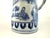 This elegant porcelain tankard captures the essence of traditional Chinese export ware with its refined blue and white...
