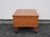 Mid-century modern style low side table with shelf below, mounted on four casters to roll where you need it most. This...