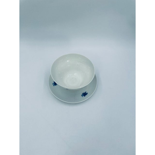 An elegant saucer and saucer from the renowned German manufacturer Rosenthal, from the Romanze in Blau series, designed by...