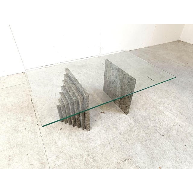 Vintage coffee table with a clear glass rectangular top and stepped granite stone bases. Very n ice, timeless design with...