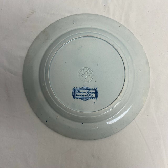 Antique circa 1818-1834 Cobrige, England blue and white plate depicting "Dr. Syntax reading his Tour". Made by James &...