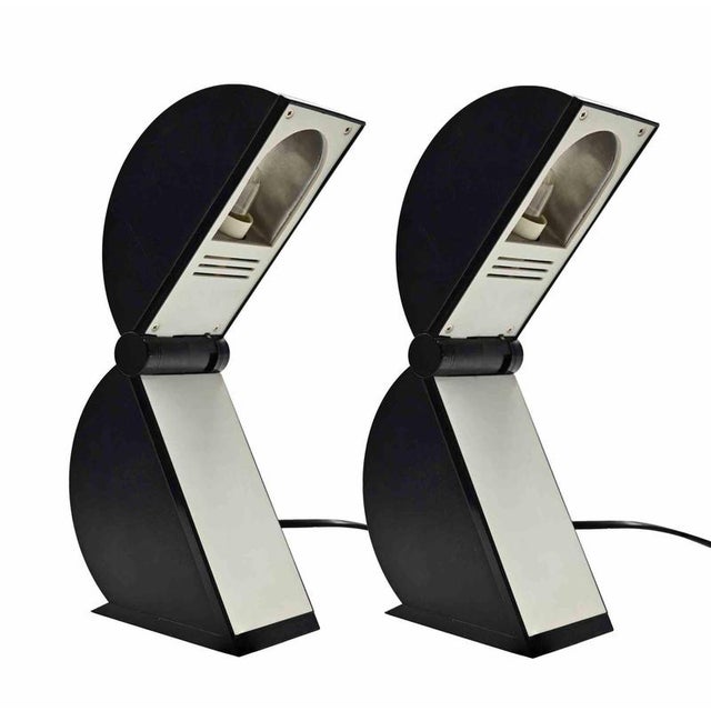 Pair of plastic table lamps by Mario Bertorelle, realized in 1980s for JMRDM. The lamp is turned on by opening and closing...