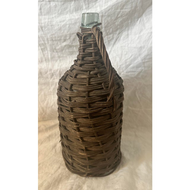 Vintage Wicker Wrapped Aqua Glass Wine Jug. Perfect for display in the kitchen or a table scape. 15.25in h x 7in base Make...