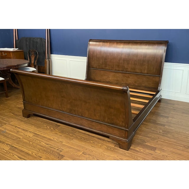 This is a traditional king size mahogany Sleigh Bed by Leighton Hall. It features a classic serpentine shaped headboard...