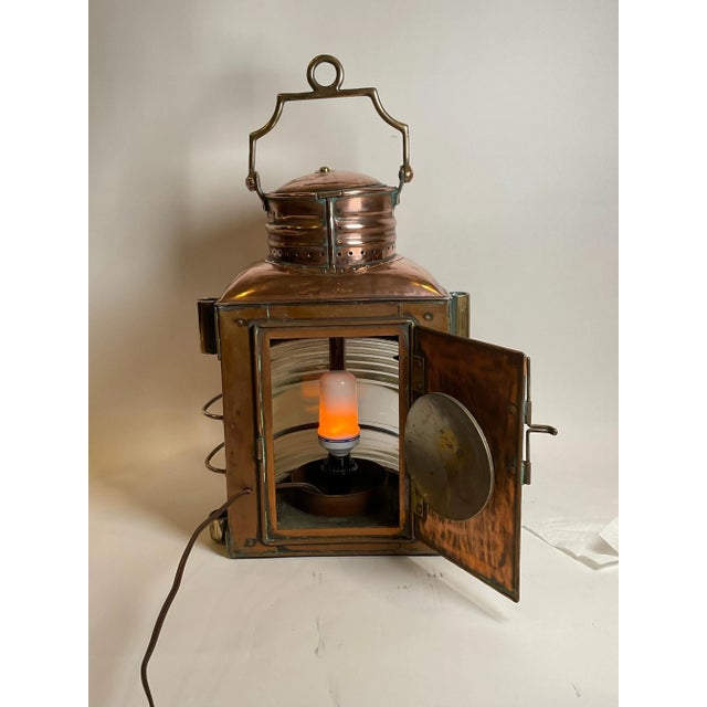 Massive polished copper ships masthead lantern. Fitted with fresnel glass lens. Large vented top, heavy brass carry...
