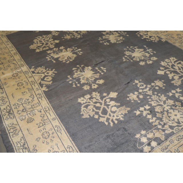 An early 20th-century square room-size Turkish Oushak rug Measures: 8'9'' x 10'9" Oushak rugs originated in the small town...
